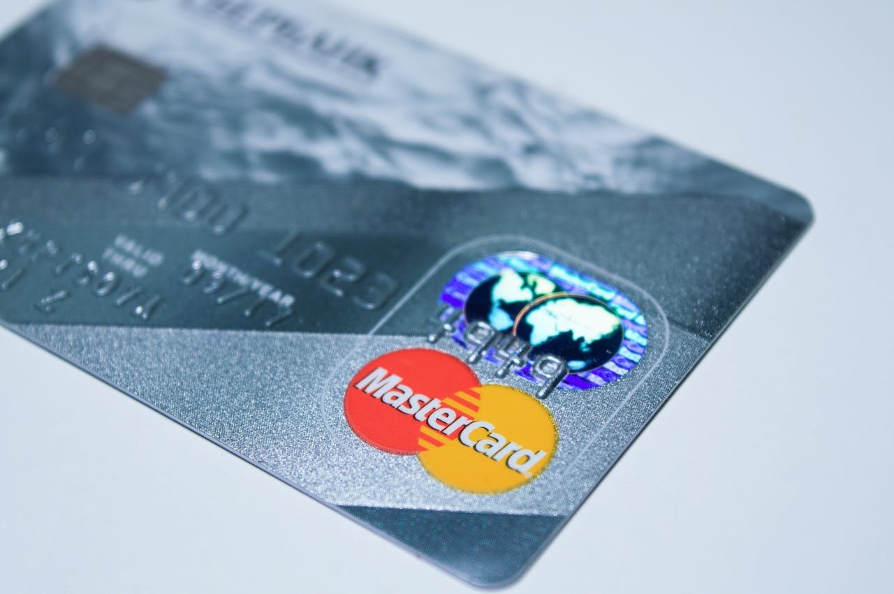 Detail shot of a MasterCard credit card, showing the chip and logo.